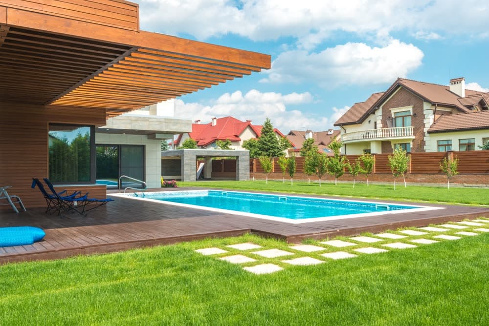 Modern backyard pool under a clear blue sky